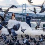 Wedding Photography by the Bosphorus Strait with flying dress in Istanbul by Entezar Studio