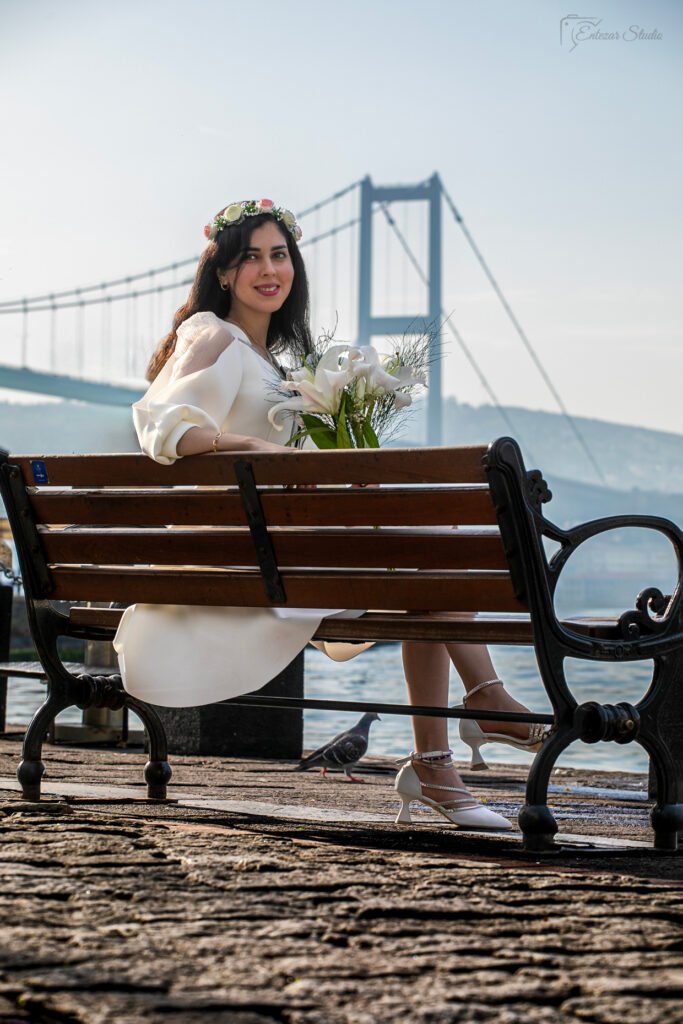 Stunning Istanbul Wedding Photography by Entezar Studio With a view of the Bosphorus Bridge and the wedding flower
