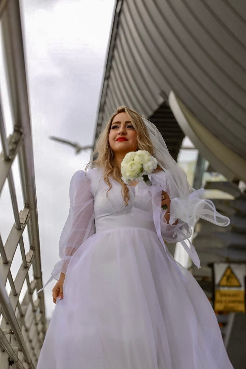 Cool bridal photography on the Golden Horn Bridge in Istanbul by Entezar Studio