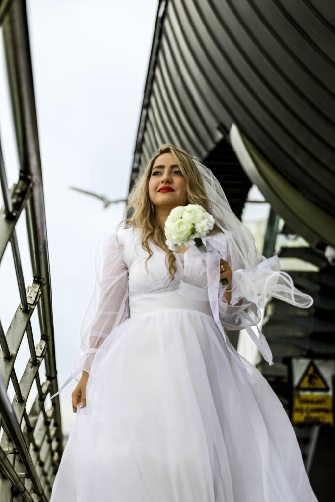 Wedding photography in Istanbul with a beautiful peony bouquet and a bridge background